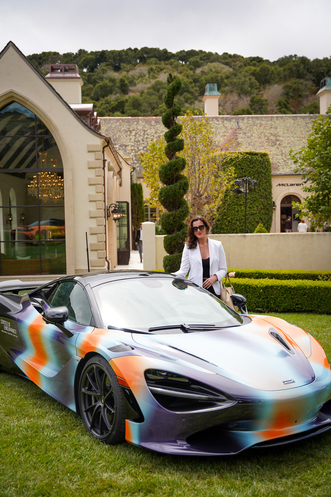 Fearlessly Forward: McLaren's Daring Spirit, Unwavering Endurance, and Drive To Win - Christina-Lauren Pollack at Château McLaren at Monterey Car Week - Image credit Brooke Damnavits