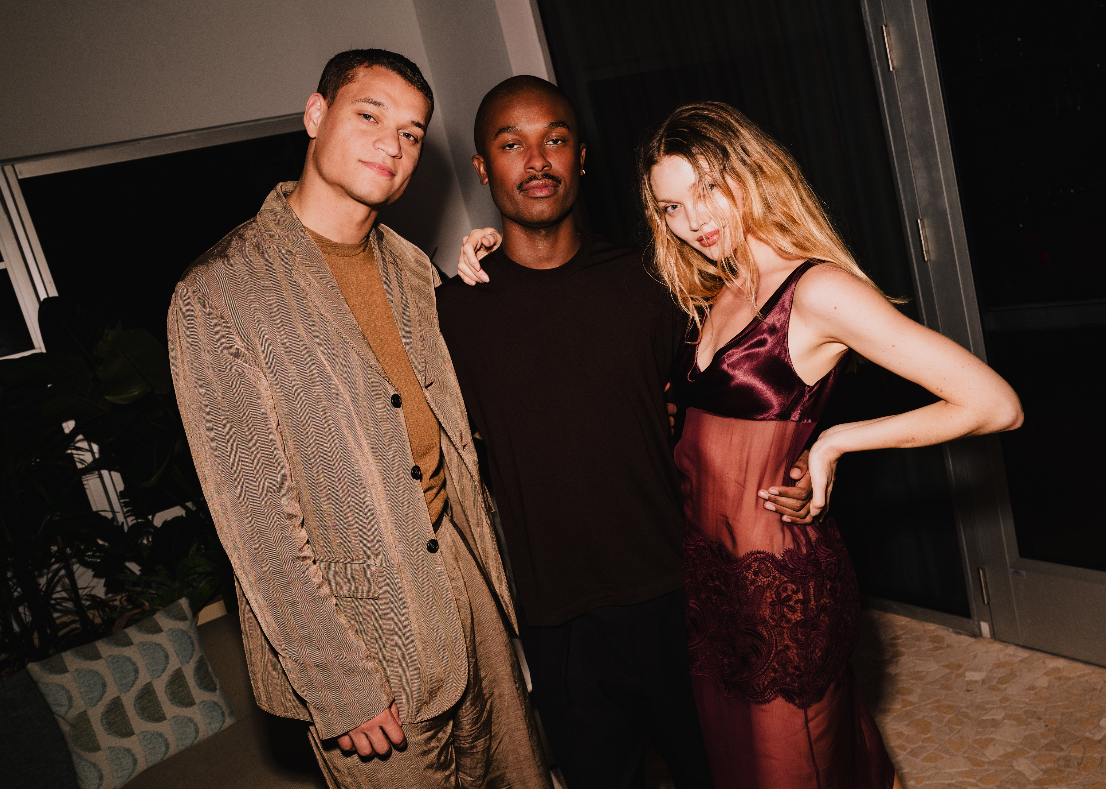 Inside Miami Art Week - Where Luxury Houses and Creative Visionaries Defined the Season - Tyriq Withers, Ferragamo Creative Director Maximilian Davis, and Jessie Andrews at Ferragamo Miami Art Week - Image credit BFA
