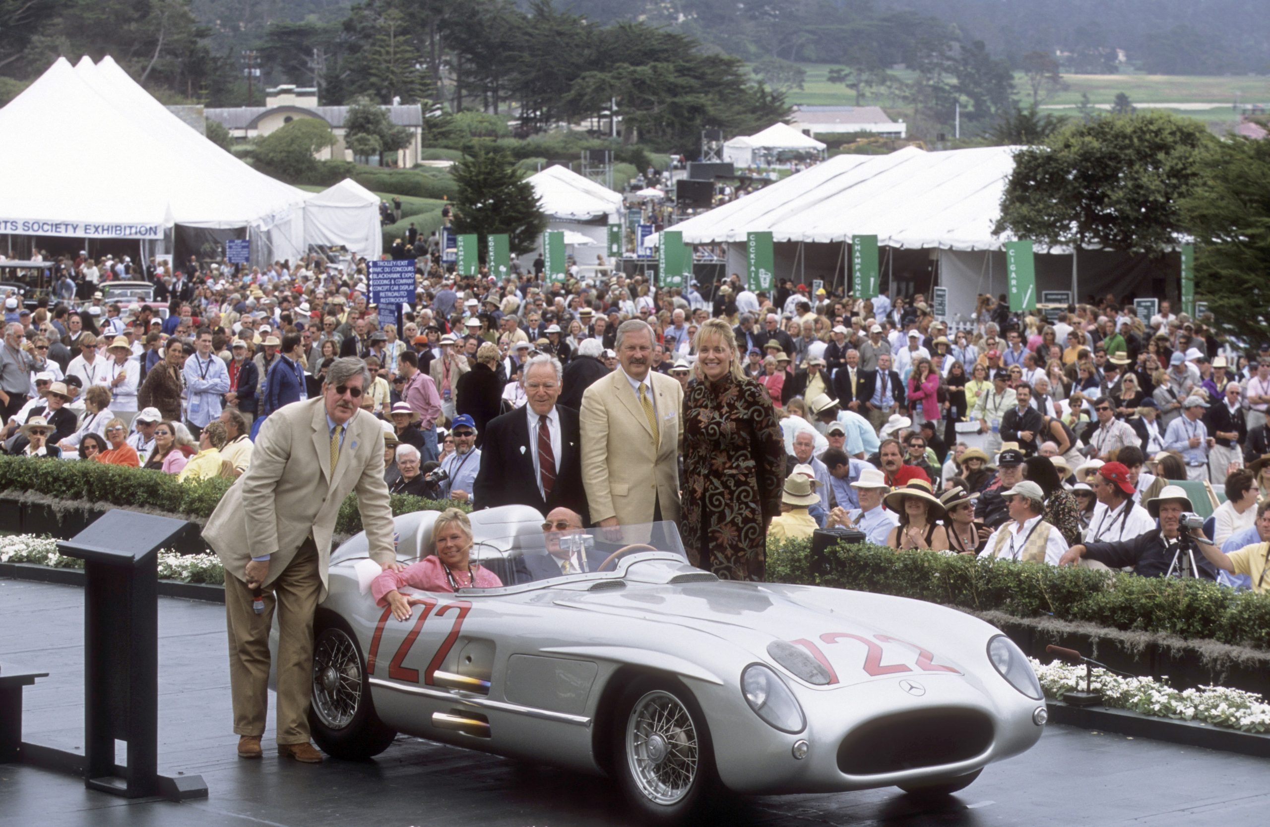 In the Driver’s Seat: How Sandra Button Steered The Pebble Beach Concours d’Elegance for 40 Years - Ed Herrmann, Lady Susie Moss, Sir Stirling Moss, Jules Heimann, Glenn Mounger, Sandra Button - Image credit: Doug Sandberg/Pebble Beach Concours d'Elegance